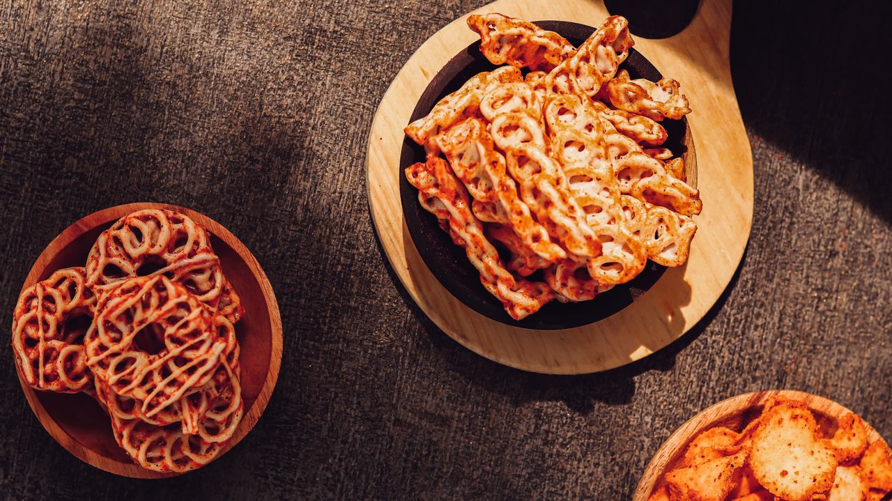 Delicious spicy Indian snacks arranged in bowls, perfect for a savory treat.